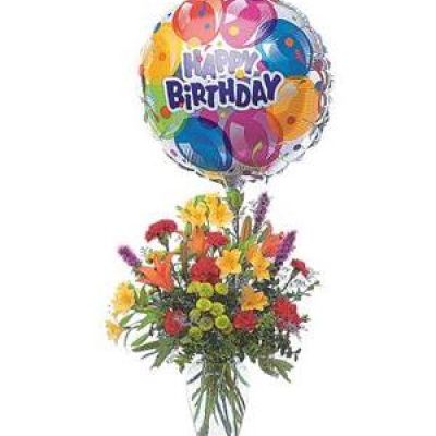 <p>Take their birthday to brand new heights with this colorful arrangement of flowers and a high-flying birthday balloon.<br />
Alstroemeria, carnations, chrysanthemums and lilies are delivered in a clear glass vase with attached foil balloon.</p>